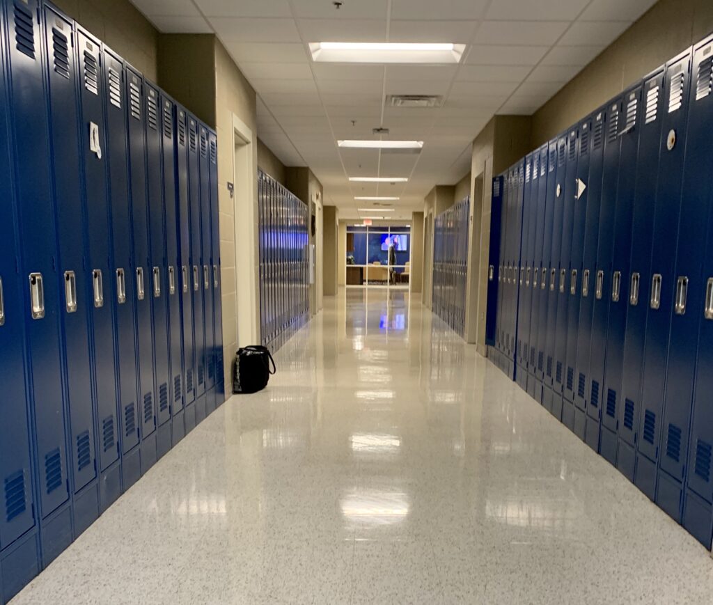 empty-school-hall-with-blue-lockers-during-coronav-2022-11-11-16-43-32-utc